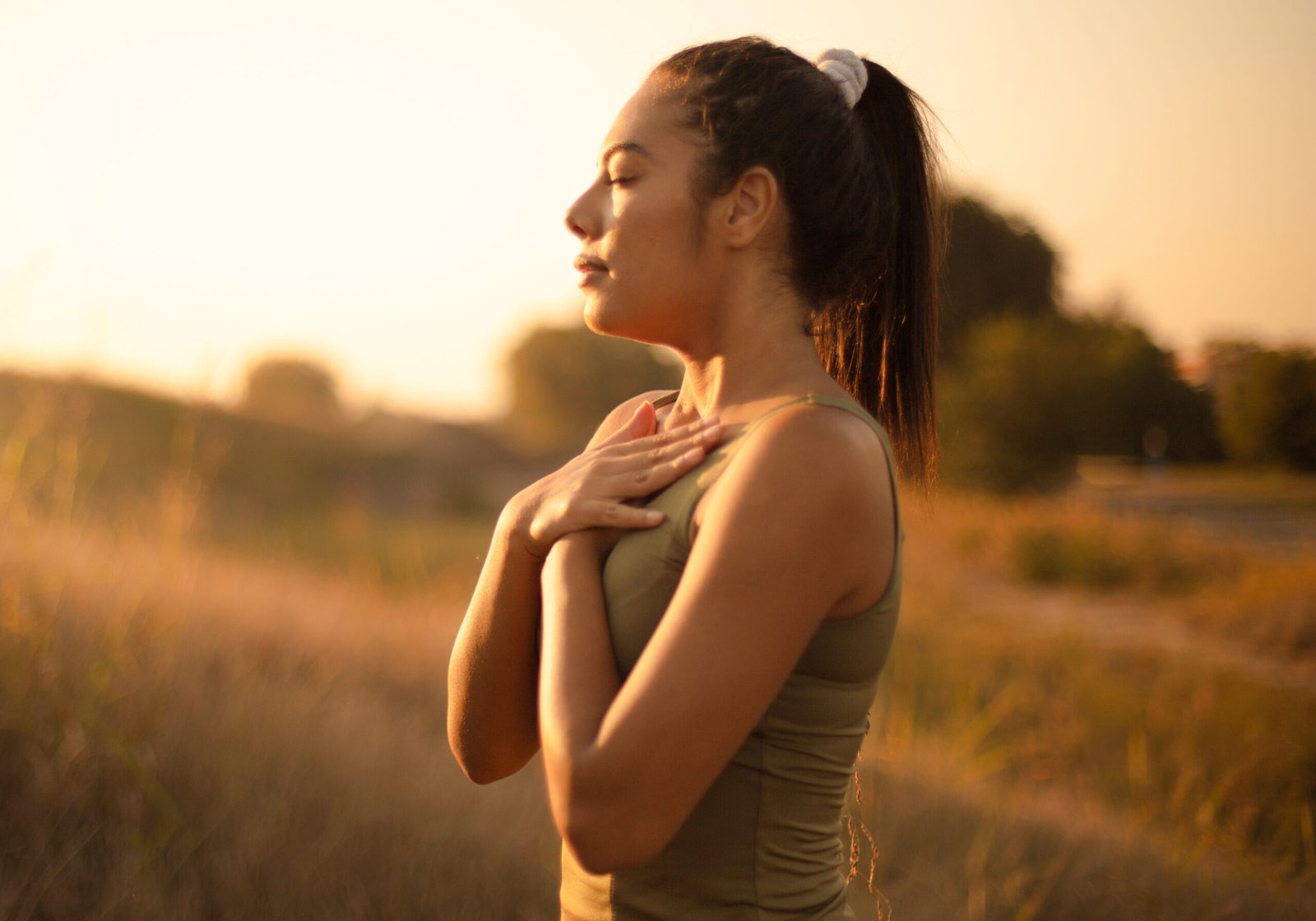 African young woman in nature working yoga.
